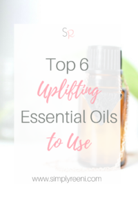 essential oil bottle and necklace with text overlay- Top 6 Uplifting Essential oils to use