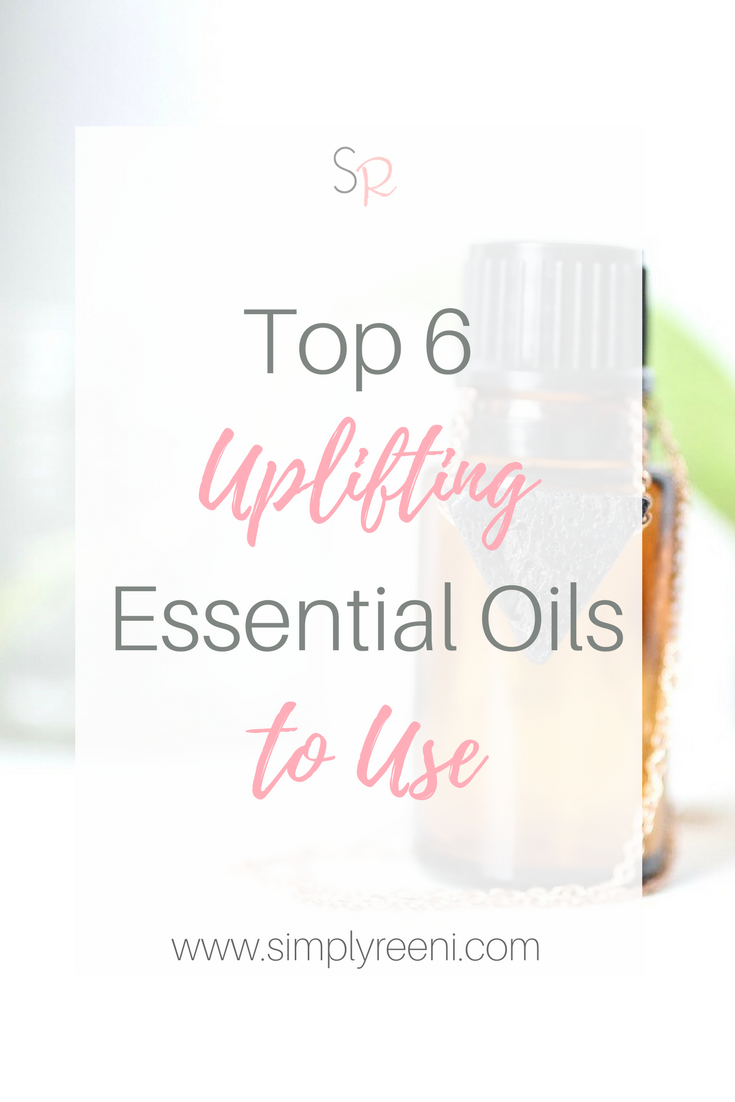 essential oil bottle and necklace with text overlay- Top 6 Uplifting Essential oils to use